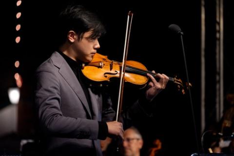 Simon Zhu playing his violin during the CLIP concert 