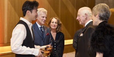 LSO Gala Concert, violinist Simon Zhu holding 'Il Cannone_, The King, Dame Kathryn McDowell (far right)